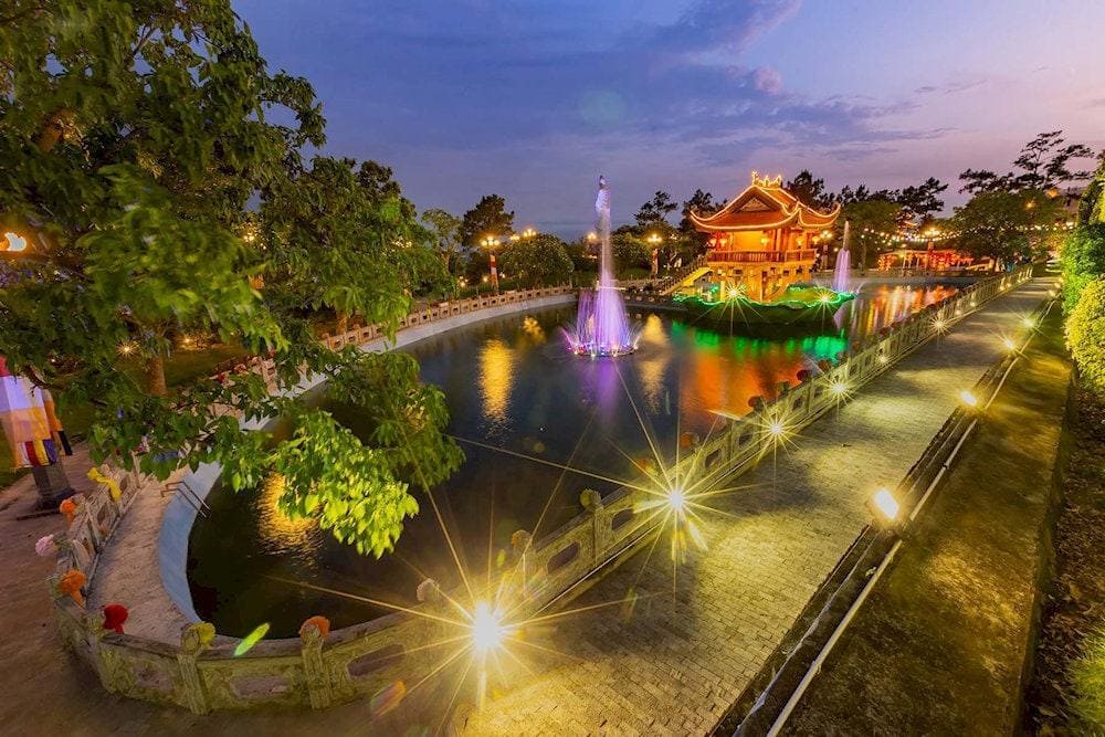The One Pillar Pagoda stands majestically in the middle of the Crescent Lake