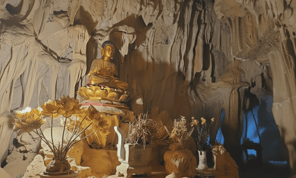 Light streams through a natural skylight, illuminating the sacred altar inside