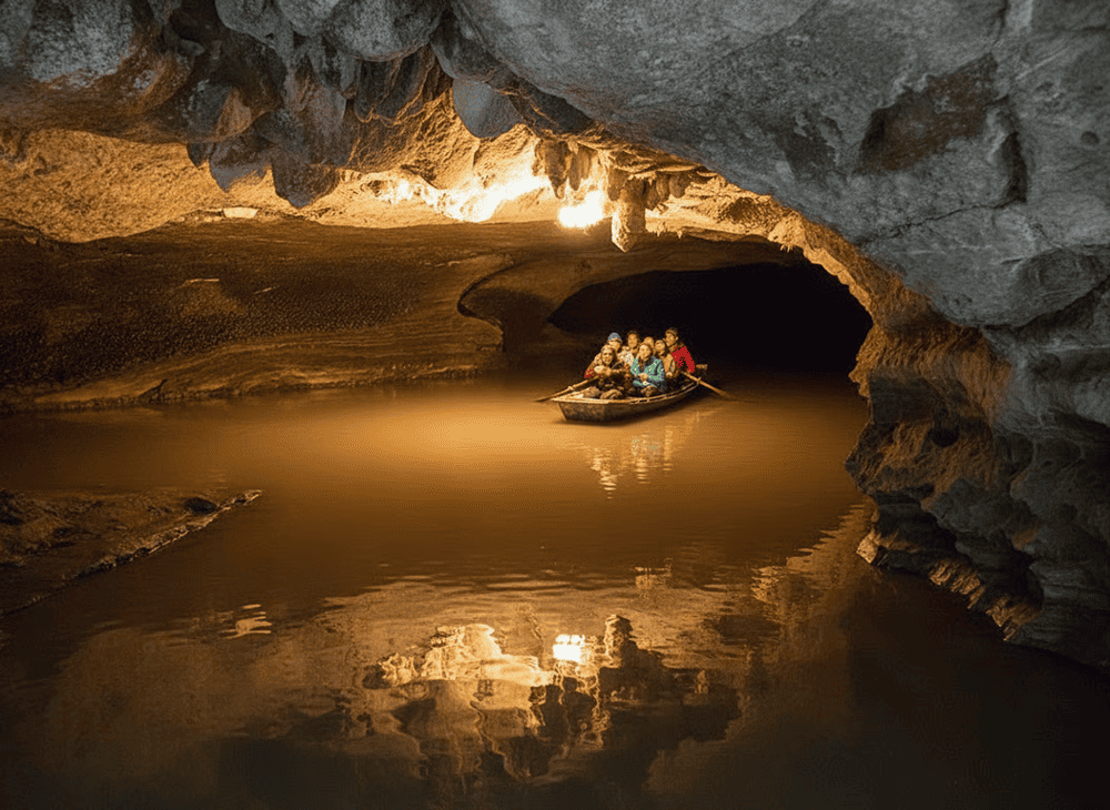 The cave’s mouth is low, dark, and narrow, evoking a sense of mystery as if entering another hidden world