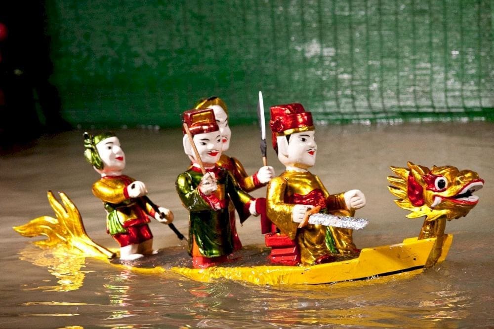 Puppeteers would wade through the water, making wooden puppets appear to dance and interact, bringing local legends and daily life to the stage
