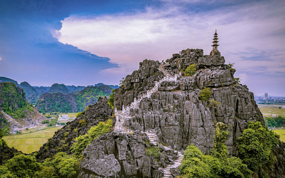 As you ascend the mountain, spiritual sanctuaries nestled in the rocks invite quiet reflection and a deeper connection to the land