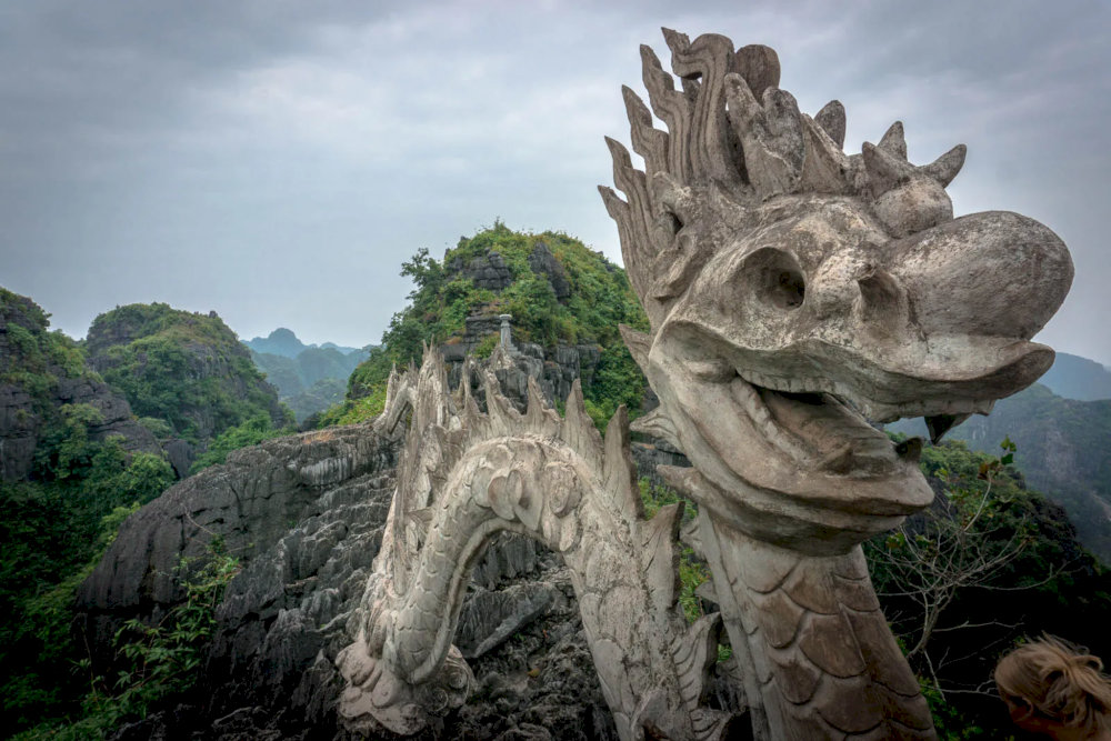 This intricate statue, inspired by traditional Vietnamese mythology, gives the mountain its legendary name