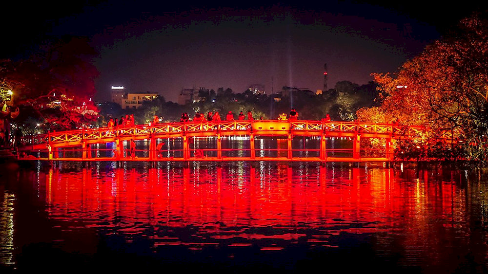 The Huc Bridge at night takes on a shimmering and magical beauty
