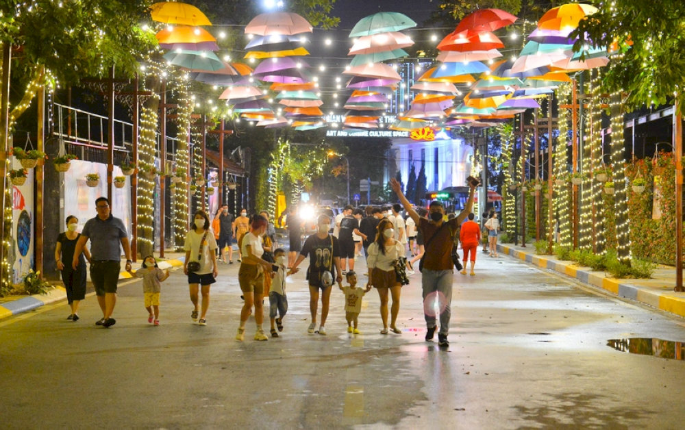 The walking street comes alive with vibrant colors at night
